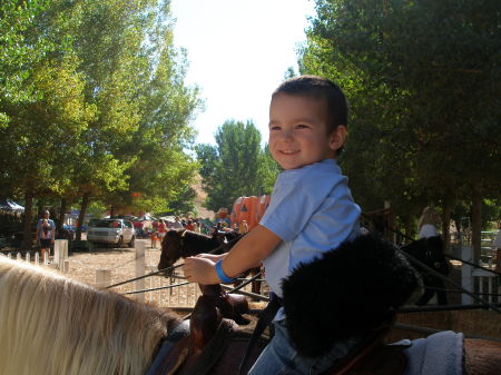 My grandson, Tanner, on his first pony 10/08