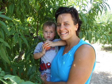 William and Stacie picking peaches