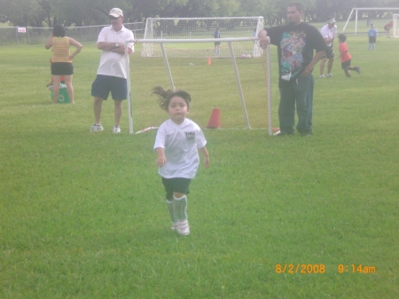 Teagan playing soccer