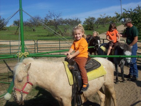 Tara on a horsey ride. Taylor is right behind