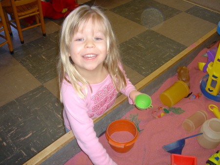 Olivia Playing in the sand box