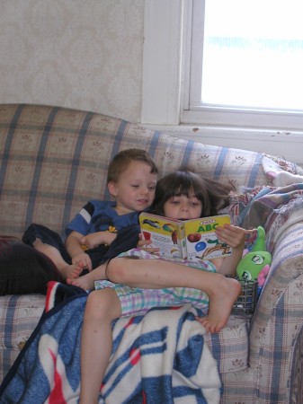 Charis age 6 reading to Elias age 2