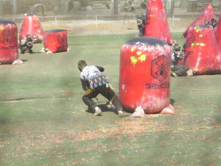 Boys playing paintball.