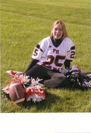 Kristi in her football cheerleading outfit