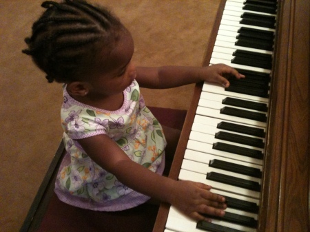 Arielle on the piano at church