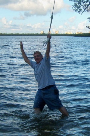 Bob swinging from rope swing. SPLASH!