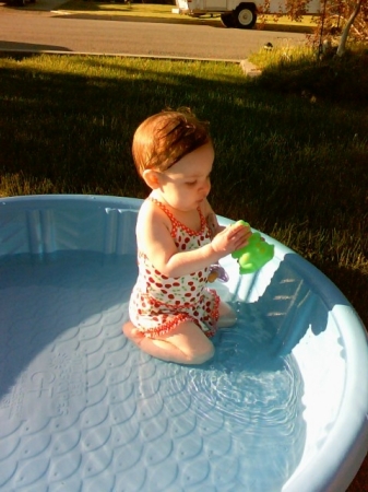 Swimming in her first pool
