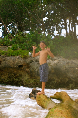 Wesley "Log-surfing" at playa carribe