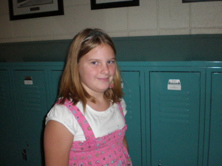 Celina in front of her locker