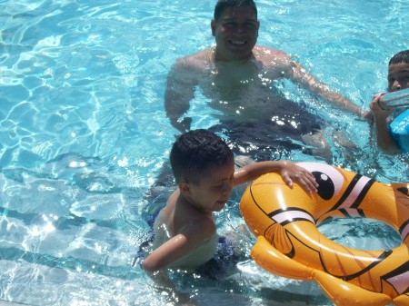 daniel, daddy and anthony at the pool