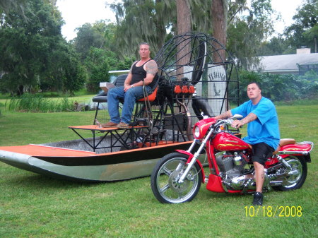 me on my airboat... my son on the harley