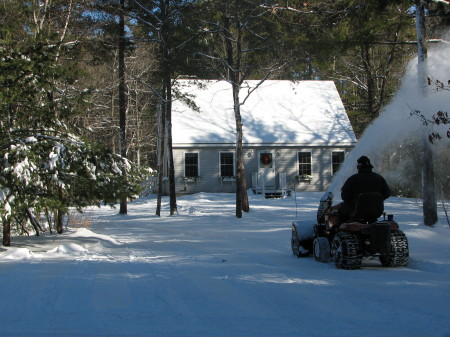 Blowing snow around our home.