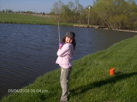 Brianna fishing in her pond