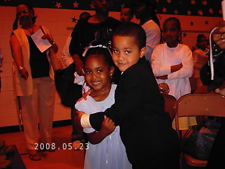 Na'm and friend at kindergarden graduation