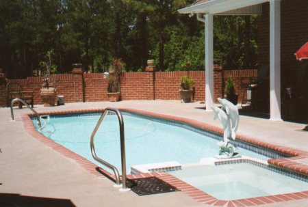Fiberglass pool in courtyard