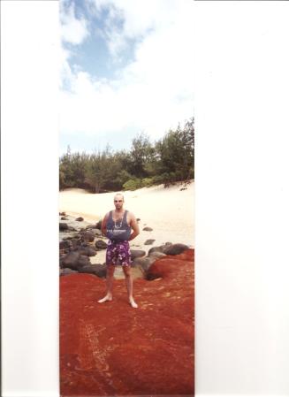 Gabe on red sands of Hawaii