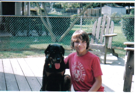 My stepson , Nicholas with Jack, my rottie pup