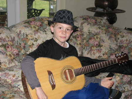 Jeffrey playing the guitar