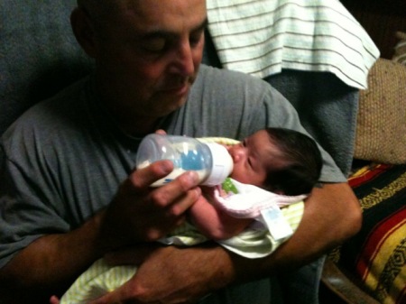 Grampa feeding Evie