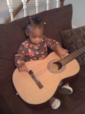 Arielle on the guitar.