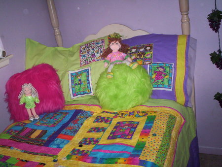 Allie's quilt with her dollies and pillowcases
