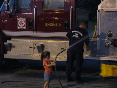 maddy helping her daddy at firestation