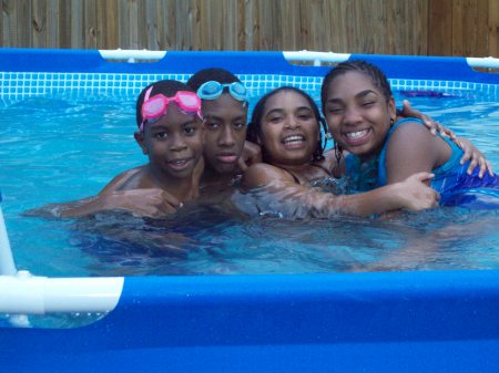 My boys and my nieces chillin in the pool