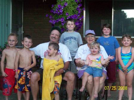 Me & Pat and our 7 grands posing "nice".