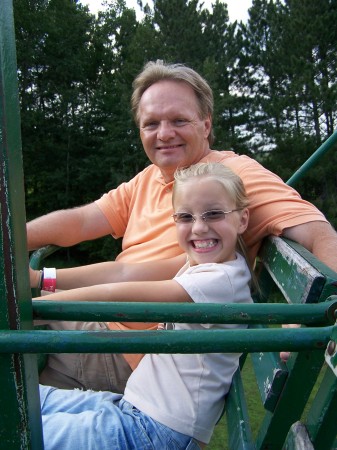 Dad and Daughter on Chair Lift.