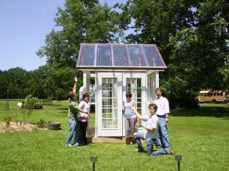 The kids and Perry working on the greenhouse