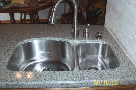 New sink--verses the old dented alum. sink