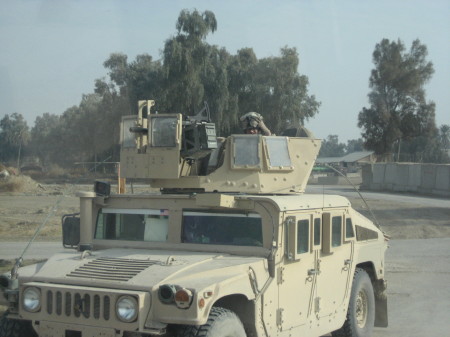 Marine going out on patrol with his up armored humvee with up dated turret