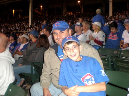 Husband and son watching the Cubs