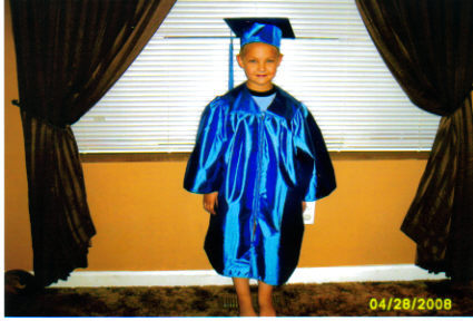 JJ in his cap and gown for preschool grad.