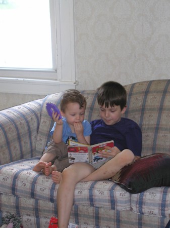 Zachary age 8 reading to Silas age 2