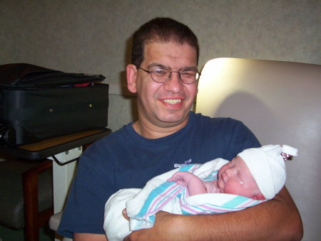 My husband with our 3rd child (who is now 4)