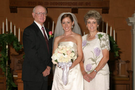 My mom & dad with Tiffany at her wedding
