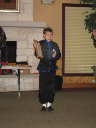 Matthew Earns his black belt July 2008 Age 10