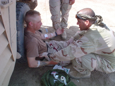 SGT Patrick McCaffrey helping a friend on his