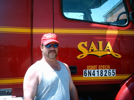 Hubby infront of his work truck