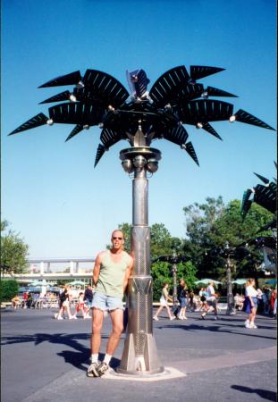 uncle dave next to metal palm tree