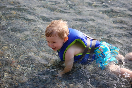 Aiden playing in the water