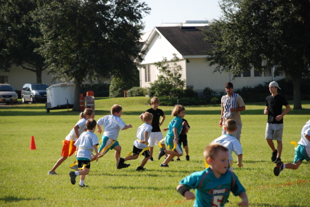 Lil' T playing Flag football