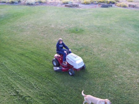Keith doing chores, cutting the grass.