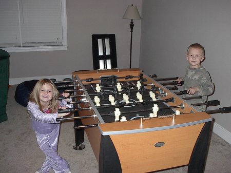 kids playing foosball