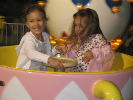 Bella and Lea spinning fast on tea cups