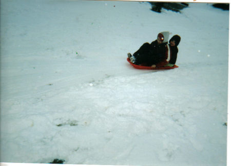 my two sons playing in the snow