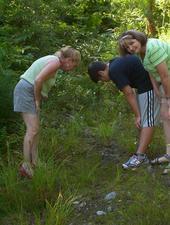 Donna, Dan & Deb looking at moose tracks