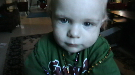 Gavin wearing Mardi Gras beads