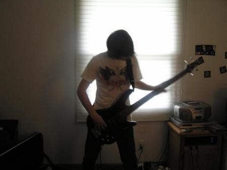 Josh playing his bass guitar